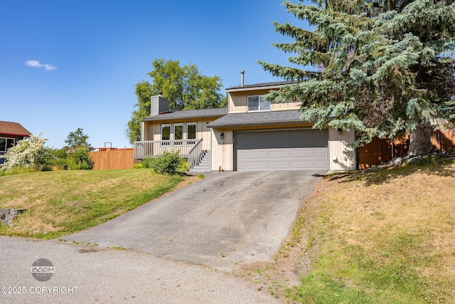 9645 Nulato Cir, Eagle River, AK 99577 - tri-level home featuring driveway, a chimney, and an attached garage