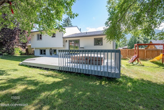 9645 Nulato Cir, Eagle River, AK 99577 - back of property with a playground and a deck