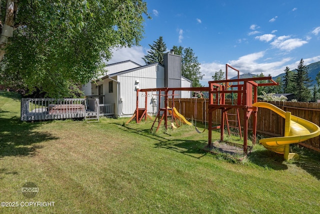 9645 Nulato Cir, Eagle River, AK 99577 - view of play area featuring a fenced backyard and a deck