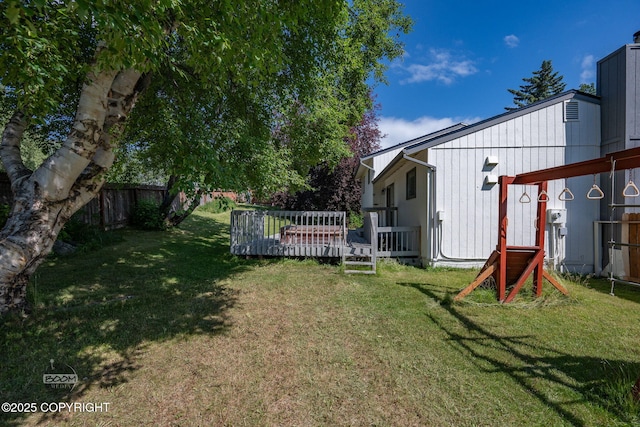 9645 Nulato Cir, Eagle River, AK 99577 - fenced backyard with a wooden deck