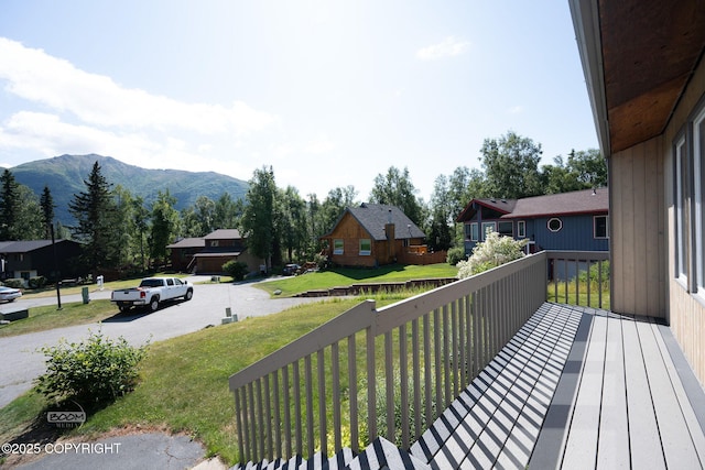 9645 Nulato Cir, Eagle River, AK 99577 - wooden deck featuring a mountain view and a yard