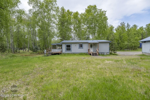 1801 W That Rd, Wasilla, AK 99623 - rear view of property with a deck