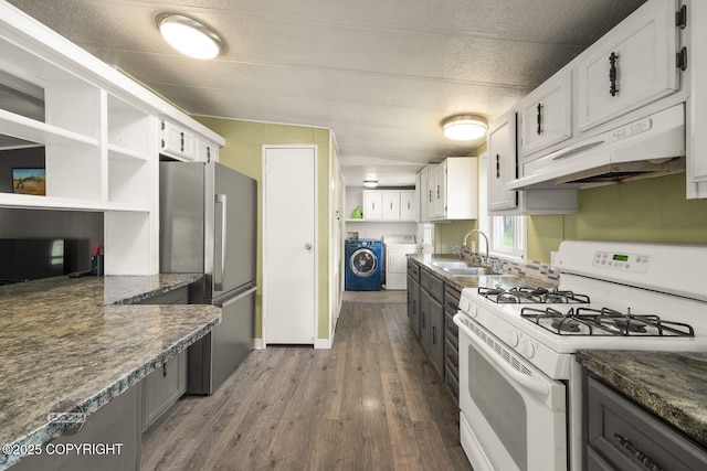 1801 W That Rd, Wasilla, AK 99623 - kitchen featuring white gas stove, freestanding refrigerator, under cabinet range hood, and open shelves