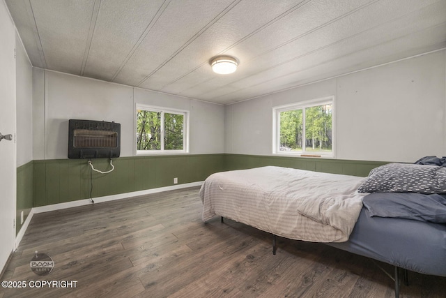 1801 W That Rd, Wasilla, AK 99623 - bedroom with multiple windows, heating unit, wood finished floors, a wainscoted wall, and wooden walls