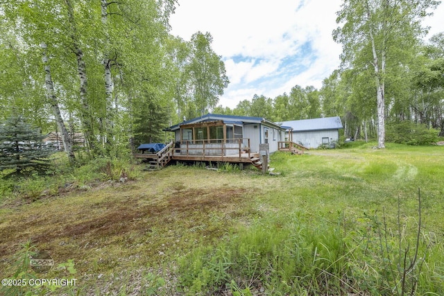 1801 W That Rd, Wasilla, AK 99623 - back of property featuring a wooden deck
