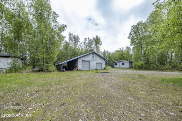 1801 W That Rd, Wasilla, AK 99623 - view of yard featuring a detached garage and an outdoor structure