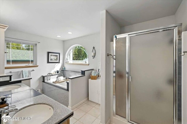 48350 Lakeside Ave, Soldotna, AK 99669 - bathroom featuring a stall shower, healthy amount of natural light, vanity, tile patterned floors, and recessed lighting