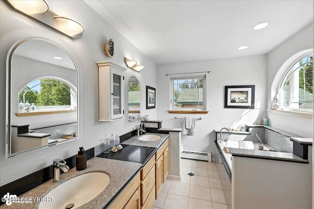 48350 Lakeside Ave, Soldotna, AK 99669 - bathroom with baseboard heating, healthy amount of natural light, a garden tub, tile patterned floors, and recessed lighting