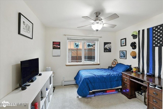 48350 Lakeside Ave, Soldotna, AK 99669 - bedroom with a baseboard heating unit, light colored carpet, and ceiling fan