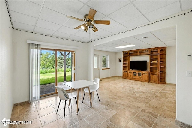 48350 Lakeside Ave, Soldotna, AK 99669 - dining room featuring built in features, a paneled ceiling, and ceiling fan