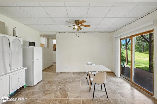 48350 Lakeside Ave, Soldotna, AK 99669 - dining space with a ceiling fan and a drop ceiling