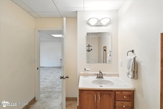 48350 Lakeside Ave, Soldotna, AK 99669 - bathroom with vanity, a drop ceiling, and tile patterned floors