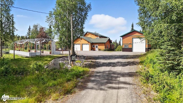 48350 Lakeside Ave, Soldotna, AK 99669 - view of front of home featuring a detached garage and an outbuilding