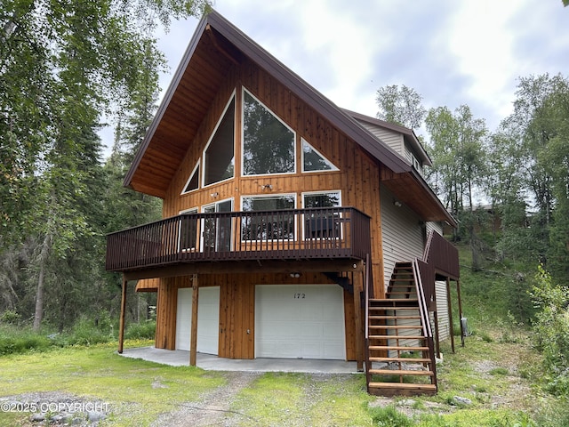 172 Linda Ln, Soldotna, AK 99669 - view of front of house with stairs, driveway, a garage, and a wooden deck