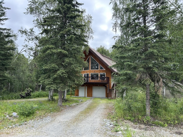 172 Linda Ln, Soldotna, AK 99669 - view of front of property with driveway, an attached garage, stairway, and a wooden deck