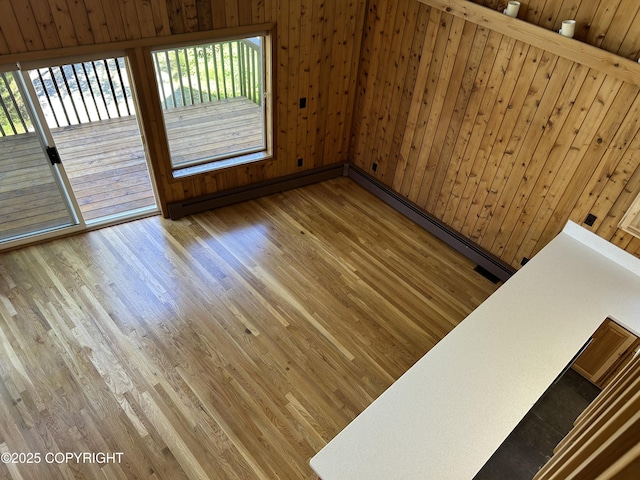 172 Linda Ln, Soldotna, AK 99669 - spare room with wood finished floors, healthy amount of natural light, and wood walls