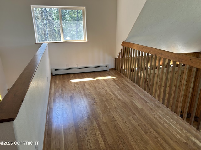 172 Linda Ln, Soldotna, AK 99669 - spare room with baseboard heating and wood finished floors