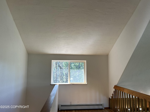 172 Linda Ln, Soldotna, AK 99669 - unfurnished room featuring a baseboard heating unit and a textured ceiling