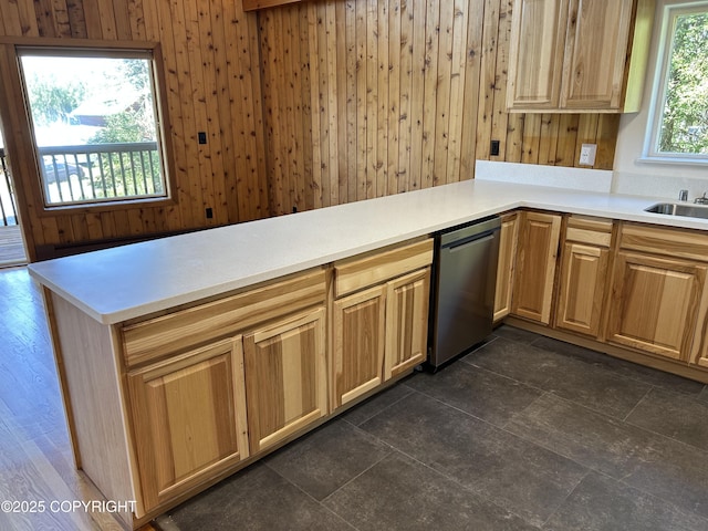 172 Linda Ln, Soldotna, AK 99669 - kitchen featuring stainless steel dishwasher, wood walls, light countertops, and a peninsula