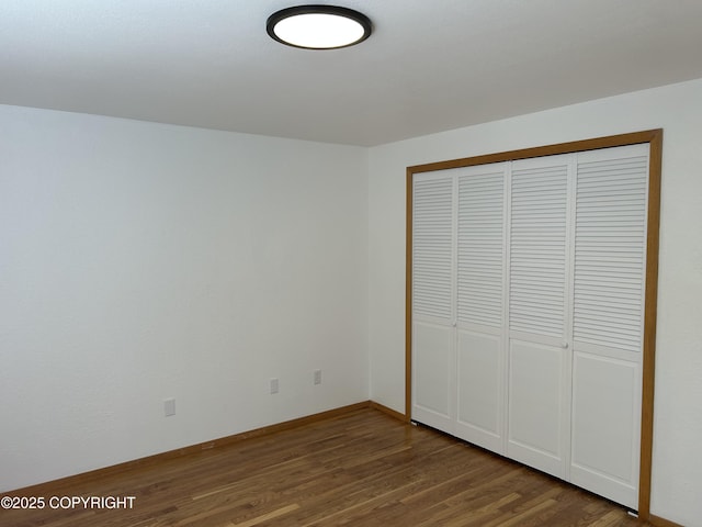 172 Linda Ln, Soldotna, AK 99669 - unfurnished bedroom featuring wood finished floors and a closet