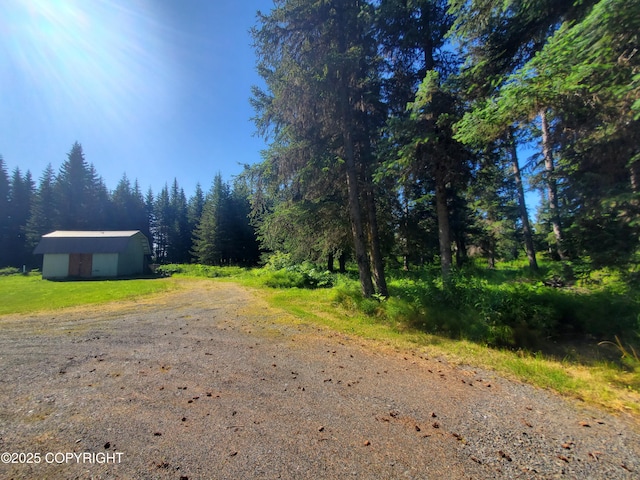 35196 Nordic Ct, Anchor Point, AK 99556 - view of road featuring a wooded view
