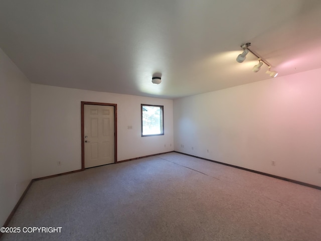 35196 Nordic Ct, Anchor Point, AK 99556 - empty room with light carpet and track lighting