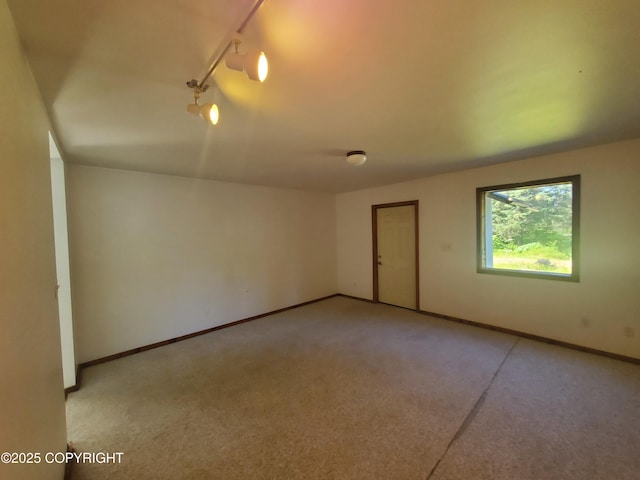 35196 Nordic Ct, Anchor Point, AK 99556 - unfurnished room with carpet flooring and track lighting