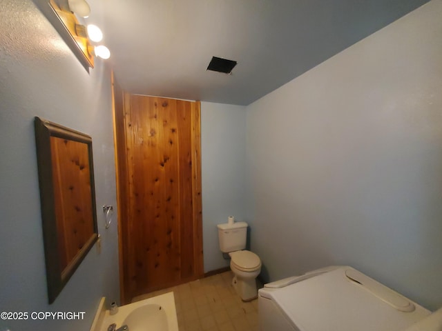 35196 Nordic Ct, Anchor Point, AK 99556 - bathroom featuring tile patterned floors and toilet