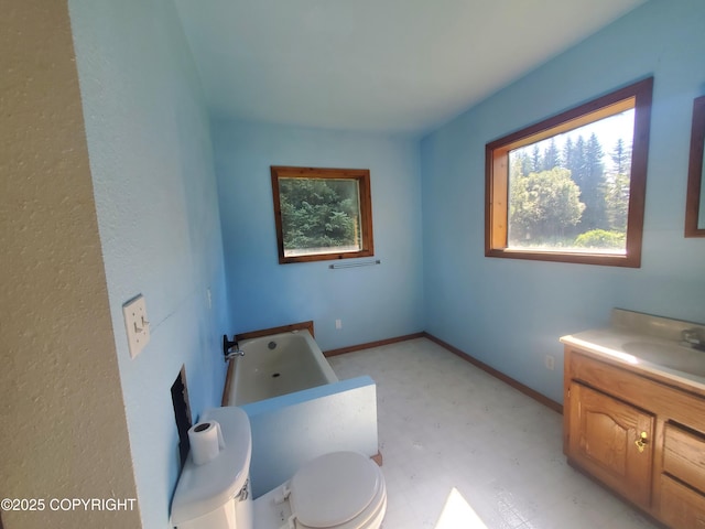 35196 Nordic Ct, Anchor Point, AK 99556 - full bath featuring vanity, a tub to relax in, and tile patterned floors