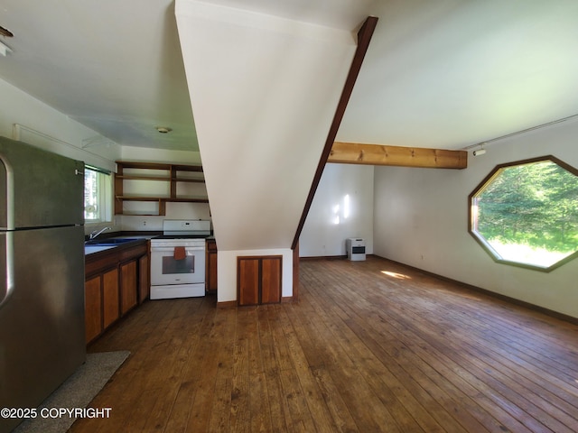 35196 Nordic Ct, Anchor Point, AK 99556 - kitchen featuring freestanding refrigerator, dark countertops, white gas stove, and dark wood-type flooring