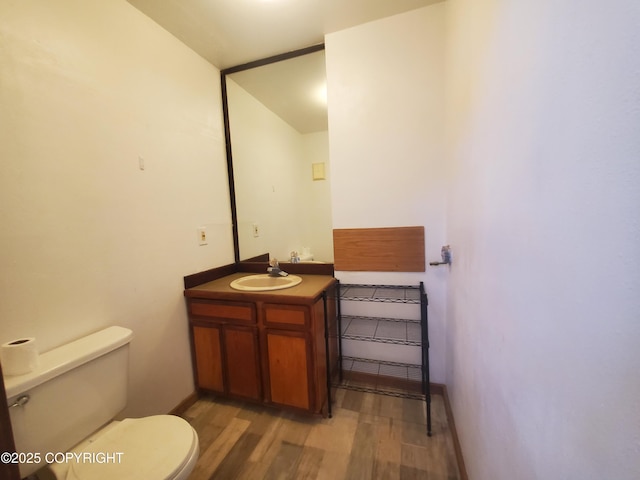 35196 Nordic Ct, Anchor Point, AK 99556 - half bathroom with vanity and wood finished floors