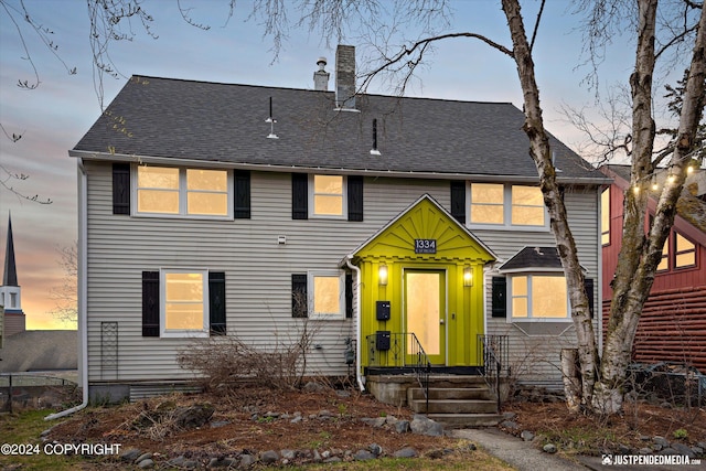 1334 K St, Anchorage, AK 99501 - view of front facade with a chimney and a shingled roof