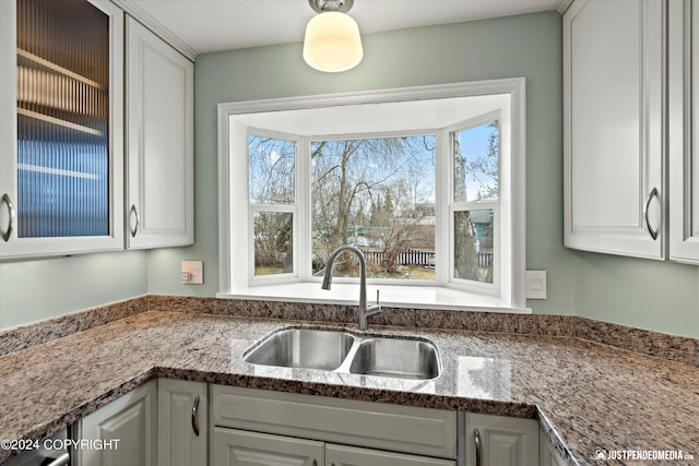 1334 K St, Anchorage, AK 99501 - kitchen with white cabinets and stone counters