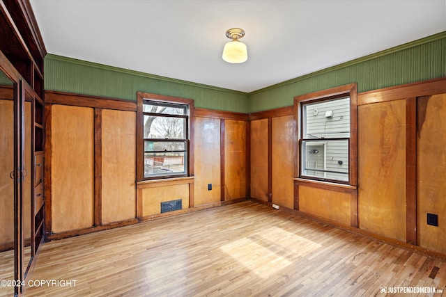 1334 K St, Anchorage, AK 99501 - unfurnished bedroom with light wood finished floors and crown molding