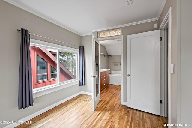 1334 K St, Anchorage, AK 99501 - unfurnished bedroom with ornamental molding and light wood-type flooring