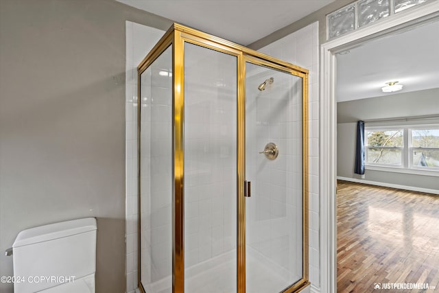 1334 K St, Anchorage, AK 99501 - bathroom with a shower stall and wood finished floors