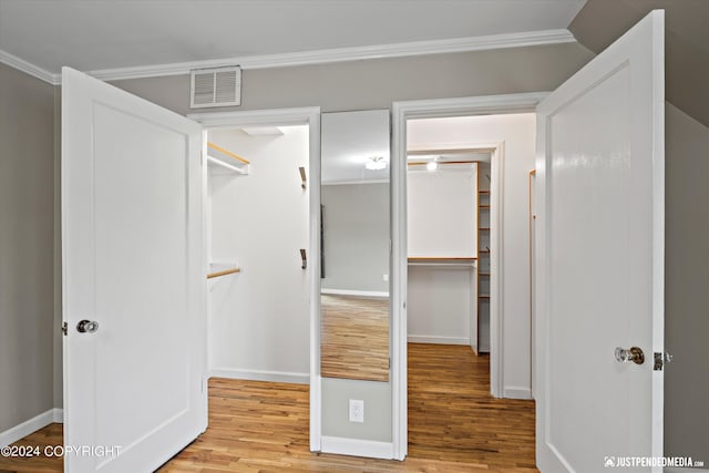 1334 K St, Anchorage, AK 99501 - corridor with wood finished floors and crown molding