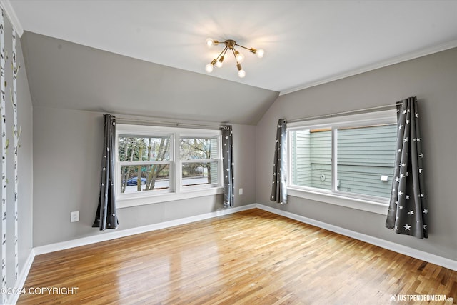 1334 K St, Anchorage, AK 99501 - unfurnished room featuring wood finished floors and lofted ceiling