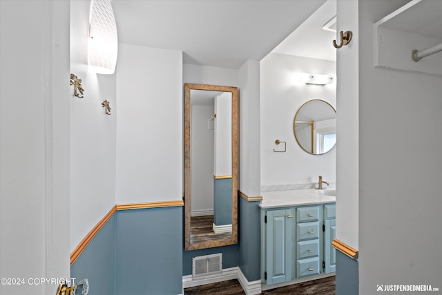 1334 K St, Anchorage, AK 99501 - bathroom featuring wood finished floors and vanity