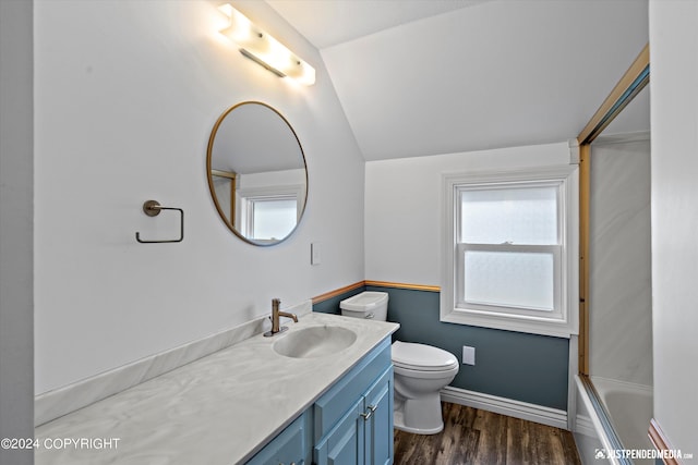 1334 K St, Anchorage, AK 99501 - bathroom featuring vaulted ceiling, vanity, wood finished floors, and bathtub / shower combination