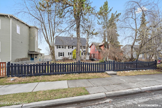 1334 K St, Anchorage, AK 99501 - view of front of home featuring a fenced front yard and a residential view