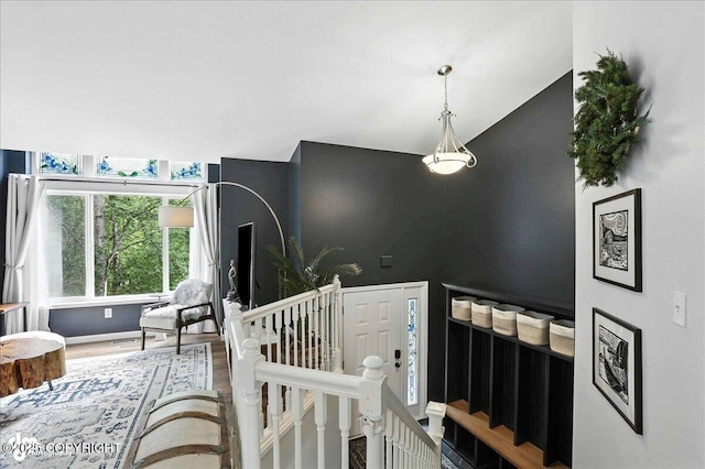 21009 River Park Dr, Eagle River, AK 99577 - stairway featuring wood finished floors and lofted ceiling
