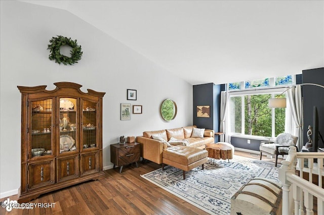 21009 River Park Dr, Eagle River, AK 99577 - living room featuring vaulted ceiling and dark wood-type flooring