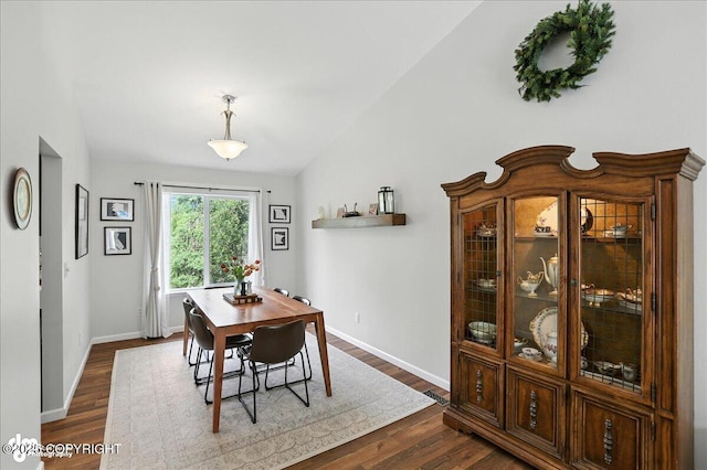 21009 River Park Dr, Eagle River, AK 99577 - dining area featuring dark wood-style floors and baseboards