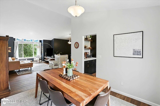 21009 River Park Dr, Eagle River, AK 99577 - dining space featuring light wood-style floors and vaulted ceiling
