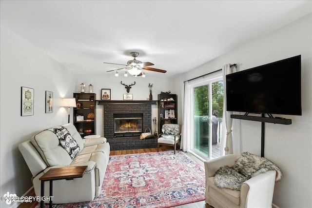 21009 River Park Dr, Eagle River, AK 99577 - living area with wood finished floors, ceiling fan, and a brick fireplace