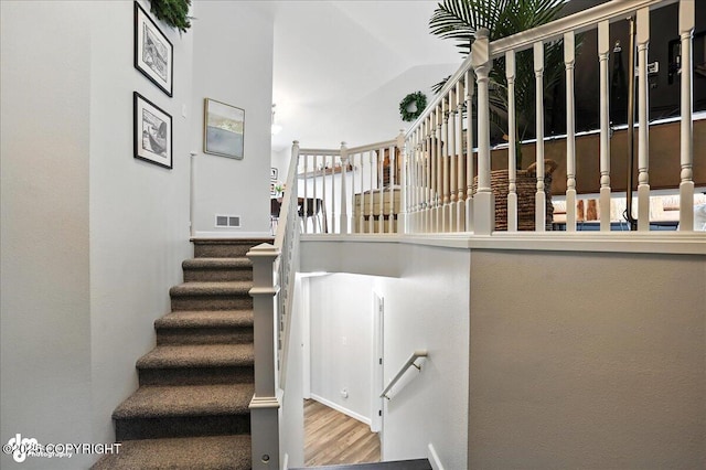 21009 River Park Dr, Eagle River, AK 99577 - stairs featuring wood finished floors