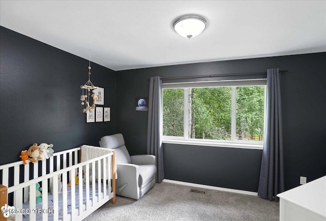 21009 River Park Dr, Eagle River, AK 99577 - carpeted bedroom featuring a nursery area and a chandelier