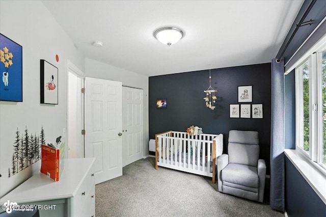 21009 River Park Dr, Eagle River, AK 99577 - carpeted bedroom featuring a closet and a crib