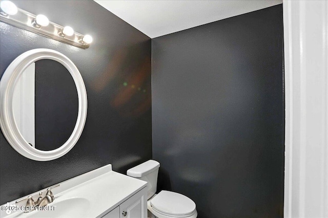 21009 River Park Dr, Eagle River, AK 99577 - half bathroom featuring toilet and vanity